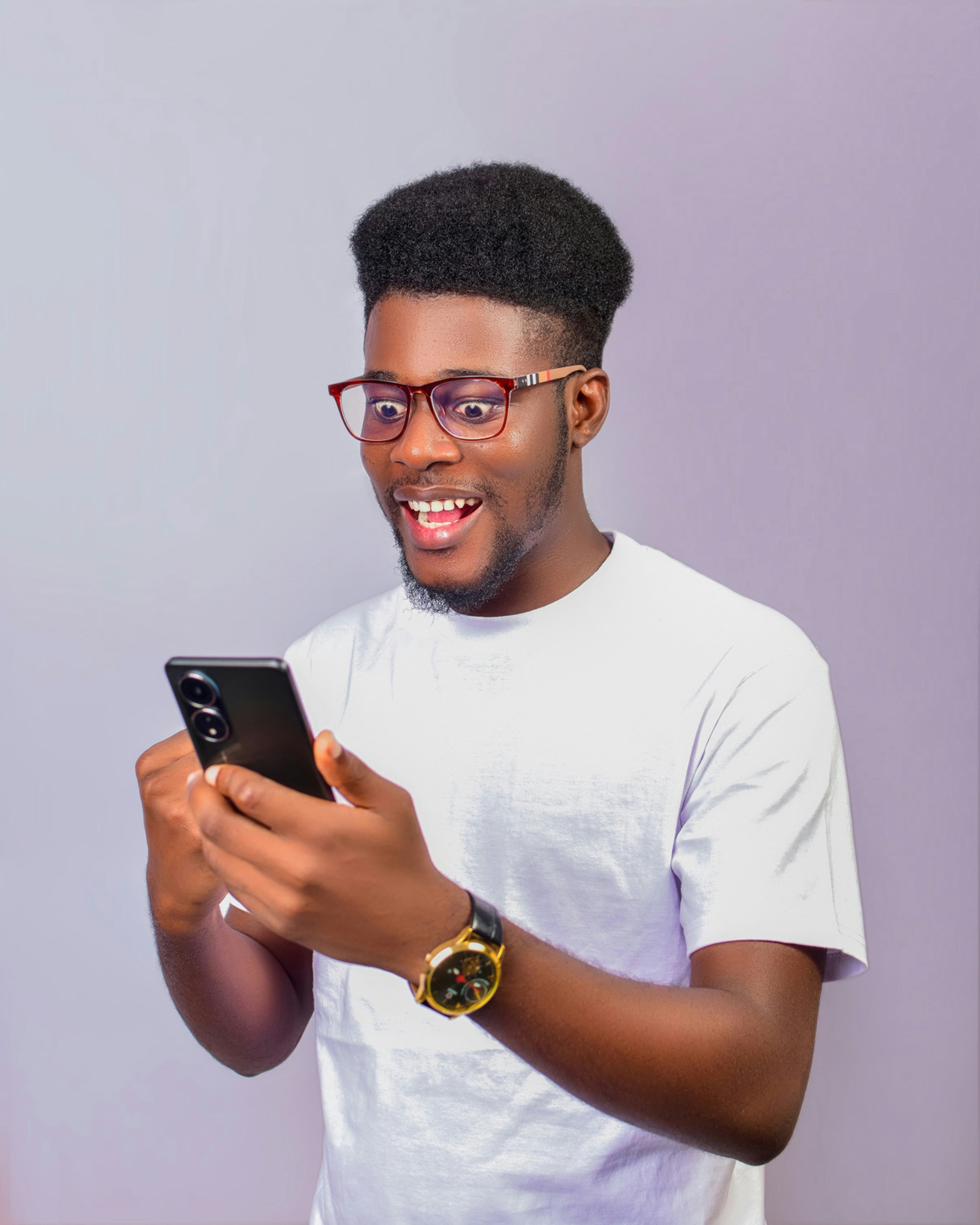 Man smiling at his phone